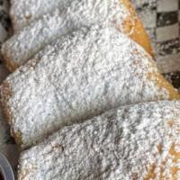 Beignet · 5-pieces French doughnut sprinkled with powdered sugar with side of choc sauce