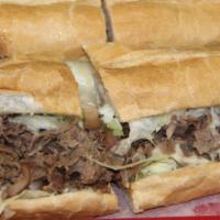 Steak & Cheese Sub · Philly beef steak, provolone, grilled onion, lettuce, tomato, mayo.