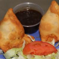 Samosas · Potatoes, green peas, ginger, garlic, chili's, spices (veg) (spicy). Contains Gluten