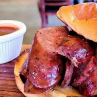 Sausage Sandwich · One sausage of choice on a potato roll, served with a 2 0z BBQ Sauce