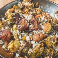 Wine Infused Brussel Sprouts · Brussel Sprouts, House Smoked Pork Belly, sautéed with herb mix, shallots, and white wine, t...