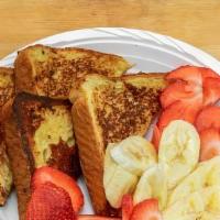 Loaded French Toast · Three pieces French toast with strawberry, blueberry and banana.