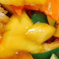Fresh Mango Chicken · Crispy white meat chicken with fresh mangos and vegs in chef's mango sauce.