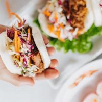 Carnitas In Steamed Buns · Brown sugar braised pork in bao buns with slaw. Hot.