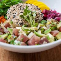 Tuna Poke · Seasoned tuna and vegetables on sushi rice. Hot and gluten free.