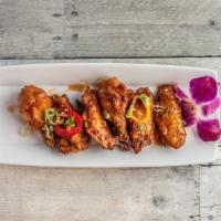 Asian Wings · Half dozen chicken wings tossed with spicy Asian BBQ sauce.