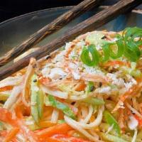 Spicy Crab Salad · Spicy crab mix with cucumber and daikon on top of spring mix and ginger dressing.