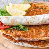 Lahmacun (Meat Pizza) · Turkish Pizza flatbread topped with minced meat, minced vegetables, and herbs including onio...