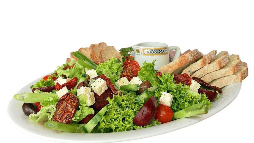 Greek Salad  · Lettuce, black & green olives, assorted vegetables & topped with feta cheese.