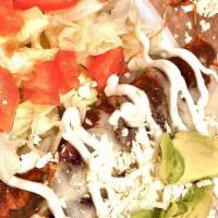 Enchiladas  · Red or green salsa
Cheese or chicken filling