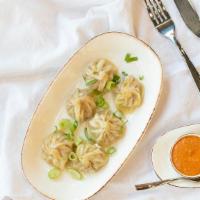 Chicken Momo (6 Pcs) · Steamed dumplings made with minced chicken, onion, garlic, ginger, and spice mix.