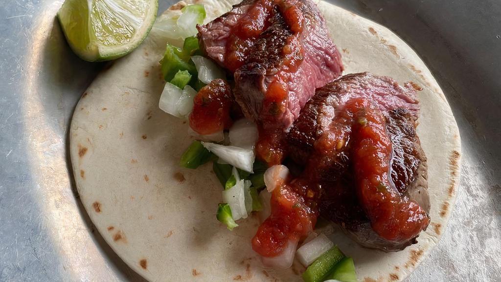Carne Asada (3 Tacos) · Gluten free. Grilled mojo skirt steak, jalapenos and onions, salsa roja.
