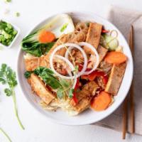 Veggie Delight · Stir-fried glass noodle, napa cabbage, bok choy, carrot, bell pepper and sautéed tofu topped...