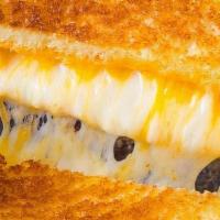 Grilled Cheese · A simple grilled cheese sandwich served with our zesty waffle fries or applesauce.