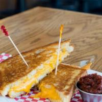 Grilled Cheese · Cheddar, Swiss & mozzarella cheese melted on buttery crunchy toasted bread.
