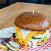 Grilled Chicken Sando · Naked Truth chicken breast, Cheddar cheese, iceberg lettuce, & ranch. Served on a Parker Hou...