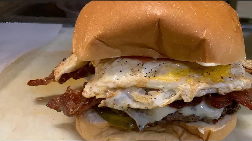 Texas Cheeseburger · Fried egg, bacon and cheese.