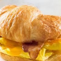 Breakfast Croissant · Scrambled egg, American cheese, choice of bacon, sausage.
