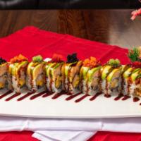 Mermaid Roll · Fried soft shell crab, crab meat tempura, mango inside with avocado, spicy lobster on top.