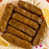 Yalanji (8 Pc) · Hand rolled grape leaves stuffed with vegetables and bulgur.