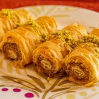 Baklava · Layers of crispy fillo dough filled with ground mixed nuts, drizzled with syrup.
