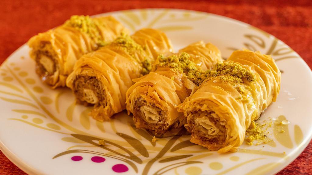 Baklava · Layers of crispy fillo dough filled with ground mixed nuts, drizzled with syrup.