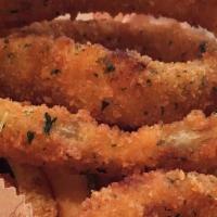 Onion Rings · Crispy breaded onion slices deep-fried until golden-brown.