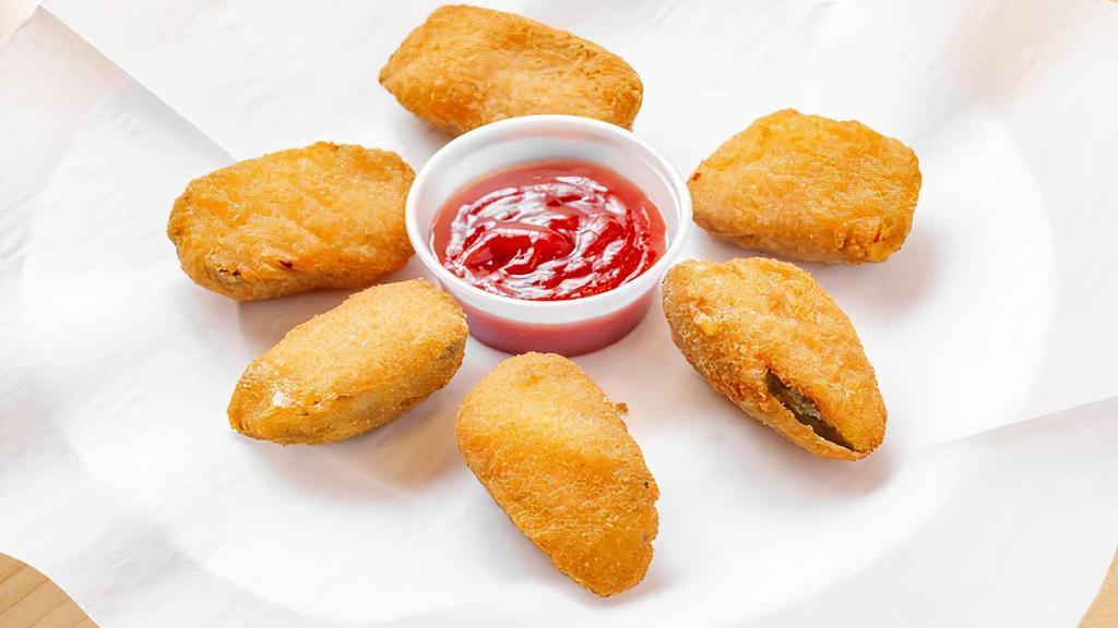 Jalapeno Poppers · Gooey, creamy, and downright delicious fried peppers with a mix of cheddar and cream cheese. Served with ketchup or Ranch