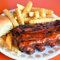 Rib Snack · 1/2 rack tender, meaty baby back ribs, small side order, BBQ sauce and dinner roll.