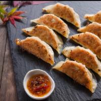Fried Dumplings · Eight pieces. Chicken with vegetables.