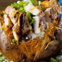 Grilled Chicken Baked Potato · Fresh baked potato loaded with butter, cheese, sour cream, bacon bits and green onions. Topp...