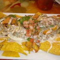 Lunch Dirty Tacos · Small version of dinner. Two dirty tacos, black beans, cheese dip, chipotle sauce and tortil...