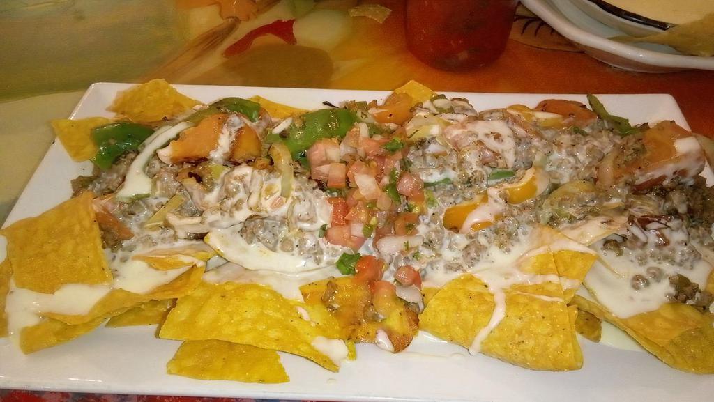 Lunch Dirty Tacos · Small version of dinner. Two dirty tacos, black beans, cheese dip, chipotle sauce and tortilla chips on the side.  (Chicken,Steak,Chorizo, Carnitas) Shrimp is $2 extra