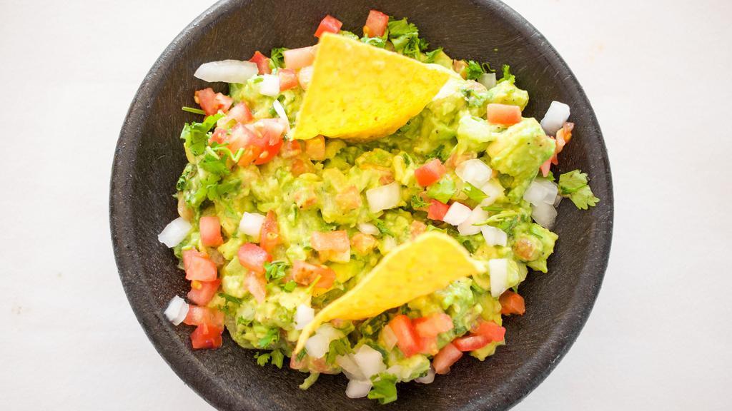Guacamole Casero · Fresh cut avocado mixed with onions, tomatoes, jalepenos, cilantro and lime juice.