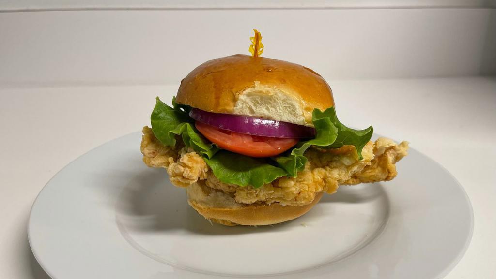Fried Chicken Sandwich · Crispy chicken sandwich served on a toasted bun with lettuce, tomato, pickles, your choice of mayo and your choice of house made chips or fries.