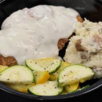 Chicken Fried Steak · Breaded beef cutlet topped with gravy, Served with mashed Potatoes, Seasonal vegetables and ...