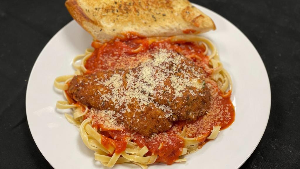 Chicken Parmesan  · Breaded chicken topped with a house made marinara sauce, parmesan served with fettucine pasta and garlic bread