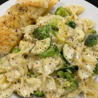 Tuscan Pasta Primavera · Bowtie pasta tossed with mixed vegetables in a beurre blanc sauce and garlic bread.