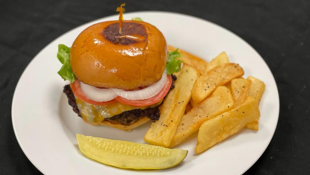 Chef Johns Angus Burger · Angus beef served on a toasted bun with lettuce, tomato, your choice of cheese, pickles and onions with choice of mayo and choice of house made chips or fries