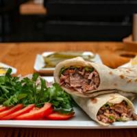 Lamb Kabob Sandwich Combo · Grilled pieces of lamb with tomatoes, onion, parsley and tahini sauce. Includes salad or fri...