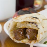 Beef Kabob Sandwich Combo · Grilled pieces of filet mignon with tomatoes, onions, parsley and tahini sauce. Includes sal...
