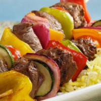 Beef Kabob Entrée · Marinated filet mignon pieces grilled to perfection, served with rice and grilled vegetables.