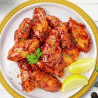 Hey Hottie Honey Wings · Breaded or naked fresh chicken wings, fried until golden brown, and tossed in honey & hot sa...