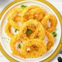 Orions Onion Rings · Sliced onions dipped in a light batter and fried until crispy and golden brown.