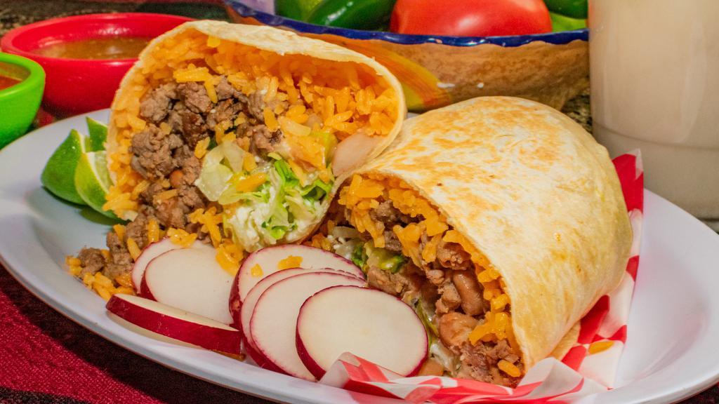 Burritos · Rice, beans, meat of your choice, lettuce, cilantro, onions, Mexican crema and Cotija cheese wrapped in a flour tortilla. Comes with 2 salsas.  We offer carne asada (grilled steak),carnitas,  beef barbacoa,  chicken tinga,  grilled chicken,  chorizo, al pastor and mixtos!