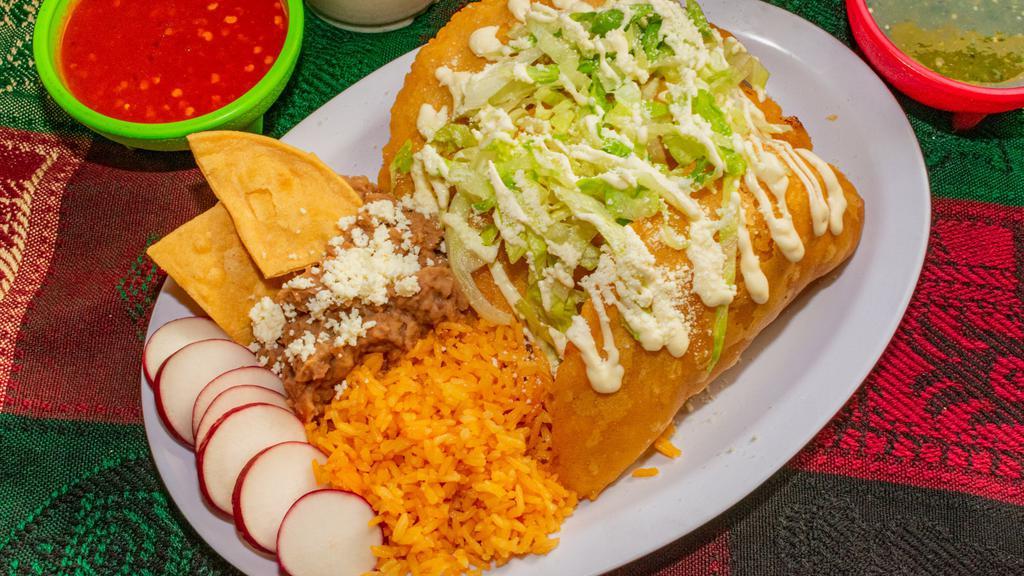 3 Empanadas Combo · 3 handmade empanadas filled with meat of your choice and Oaxaca cheese, topped with lettuce, Mexican crema and Cotija cheese. Rice and refried beans served on the side. Comes with 2 salsas.