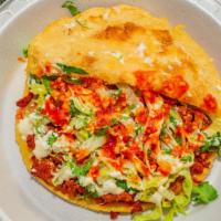 Gorditas · Handmade soft corn tortilla stuffed with refried beans and meat of your choice, then topped ...