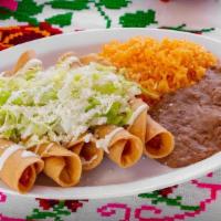 Flautas · 5 crunchy rolled chicken and mashed potato tacos topped with lettuce, Mexican crema and Coti...