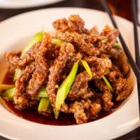 Crispy Beef · Mild spicy. Marinated thin slices of oven dried beef, fried to perfection and served with sp...
