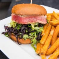 Blackened Ahi Sandwich · Blackened Ahi topped with spring mix lettuce, lemon remoulade on a brioche bun with seasoned...